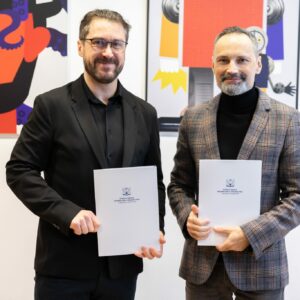 Damian Nowak - Partner Wyższej Szkoły Informatyki i Zarządzania - podpisanie dokumentów z rektorem uczelni